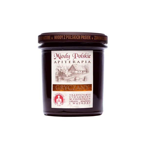 Buchweizenhonig im Glas mit einem Löffel, umgeben von Buchweizenblüten, symbolisiert natürliche Gesundheit und Wohlergehen