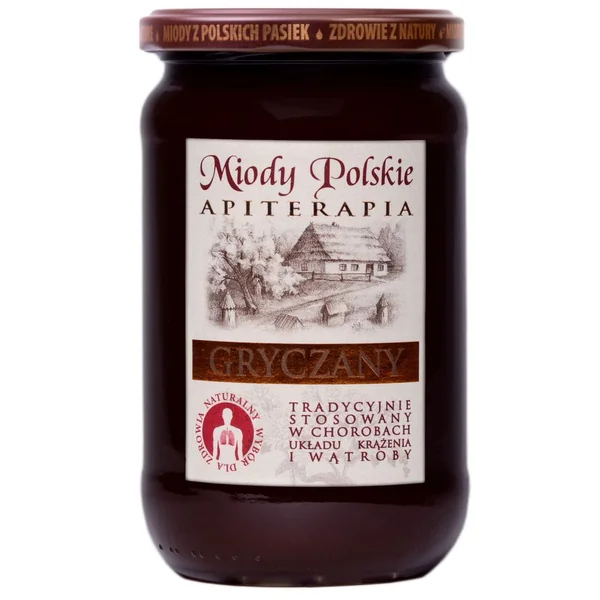 Buchweizenhonig von Miody Polskie in einem Glas mit dunkler, zäher Konsistenz.