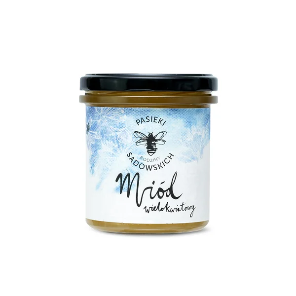 Bild des Blütenhonigs von der Familie Sadowski in einem großen Glas, das die natürliche Süße und den milden Geschmack zeigt